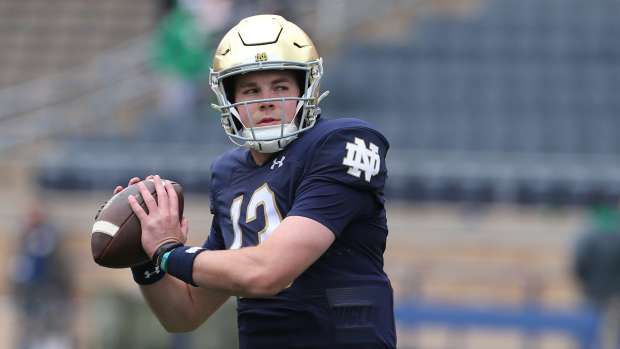 Notre Dame quarterback Riley Leonard (13) who is hurt, dresses and throws some pre-game passes with fellow quarterbacks Saturday, April 20, 2024, at the annual Notre Dame Blue-Gold spring football game at Notre Dame Stadium in South Bend. © MANDATORY CREDIT GREG SWIERCZ / USA TODAY NETWORK