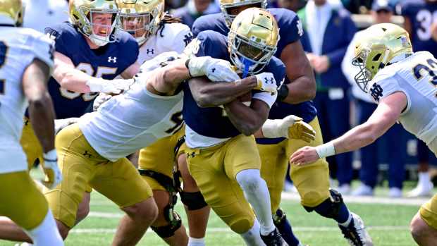 Apr 20, 2024; Notre Dame, IN, USA; Notre Dame Fighting Irish running back Jeremiyah Love (4) runs the ball in the second half of the Blue-Gold game at Notre Dame Stadium. Mandatory Credit: Matt Cashore-USA TODAY Sports