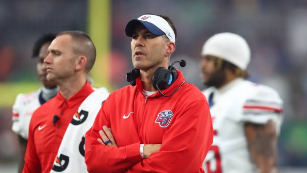 Jan 1, 2024; Glendale, AZ, USA; Liberty Flames head coach Jamey Chadwell looks on from the sidelines during the second quarter against the Oregon Ducks in the 2024 Fiesta Bowl at State Farm Stadium. Mandatory Credit: Mark J. Rebilas-Imagn Images