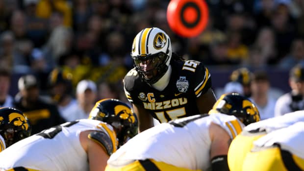 Dec 30, 2024; Nashville, TN, USA; Missouri Tigers defensive end Johnny Walker Jr. (15) sneaks a peak into the backfield against the Iowa Hawkeyes during the first half at Nissan Stadium. Mandatory Credit: Steve Roberts-Imagn Images