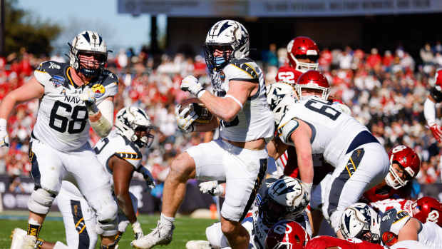 Dec 27, 2024; Fort Worth, TX, USA; Navy Midshipmen fullback Alex Tecza (46) rushes for a touchwon during the second quarter against the Oklahoma Sooners at Amon G. Carter Stadium. Mandatory Credit: Andrew Dieb-Imagn Images