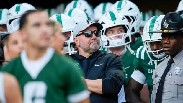 Aug 29, 2025; Charlotte, North Carolina, USA; Charlotte 49ers head coach Tim Albin and his team wait to take the field during the first quarter against the Appalachian State Mountaineers at Bank of America Stadium. Mandatory Credit: Jim Dedmon-Imagn Images