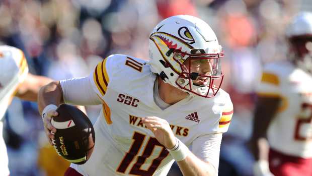 Nov 16, 2024; Auburn, Alabama, USA; Louisiana Monroe Warhawks quarterback Aidan Armenta (10) scrambles from the pocket during the fourth quarter against the Auburn Tigers at Jordan-Hare Stadium. Mandatory Credit: John Reed-Imagn Images