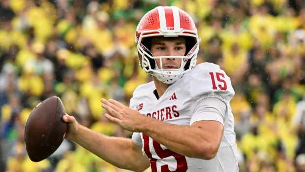 Oct 11, 2025; Eugene, Oregon, USA; Indiana Hoosiers quarterback Fernando Mendoza (15) prepares to throw the ball against the Oregon Ducks during the fourth quarter at Autzen Stadium. Mandatory Credit: Troy Wayrynen-Imagn Images