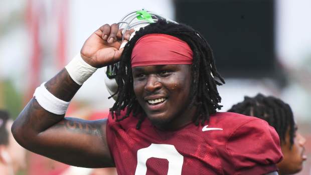 The Crimson Tide football team continued practice Thursday, Aug. 1, 2024, as they prepare for the season opener and the first game under new head coach Kalen DeBoer. Alabama linebacker Deontae Lawson (0) is all smiles during a short break for water. © Gary Cosby Jr.-Tuscaloosa News / USA TODAY NETWORK