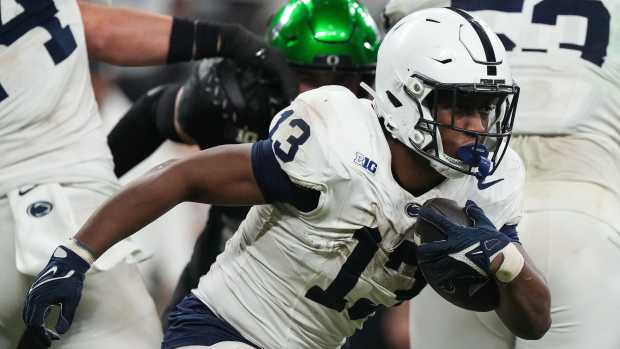 Penn State Nittany Lions running back Kaytron Allen (13) rushes up the field Saturday, Dec. 7, 2024, during the Big Ten Championship game at Lucas Oil Stadium in Indianapolis. The Oregon Ducks defeated the Penn State Nittany Lions, 45-37. © Grace Hollars/IndyStar / USA TODAY NETWORK via Imagn Images