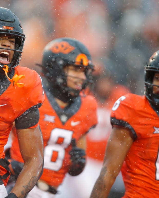 Oklahoma State Cowboys running back Ollie Gordon (0) celebrates after a touchdown during a college football game between Oklahoma State and West Virginia at Boone Pickens Stadium in Stillwater, Okla., Saturday, Nov. 26, 2022. West Virginia won 24-19. osufoot -- BRYAN TERRY/THE OKLAHOMAN / USA TODAY NETWORK