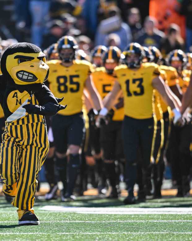 Oct 21, 2023; Iowa City, Iowa, USA; Iowa Hawkeyes Herky the Hawk leads the team onto the field during the Iowa Swarm before the game against the Minnesota Golden Gophers at Kinnick Stadium. Mandatory Credit: Jeffrey Becker-USA TODAY Sports