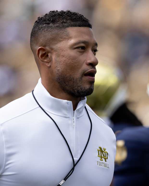 Notre Dame head coach Marcus Freeman jogs the field during warm-ups before a NCAA college football game between Notre Dame and Northern Illinois at Notre Dame Stadium on Saturday, Sept. 7, 2024, in South Bend.