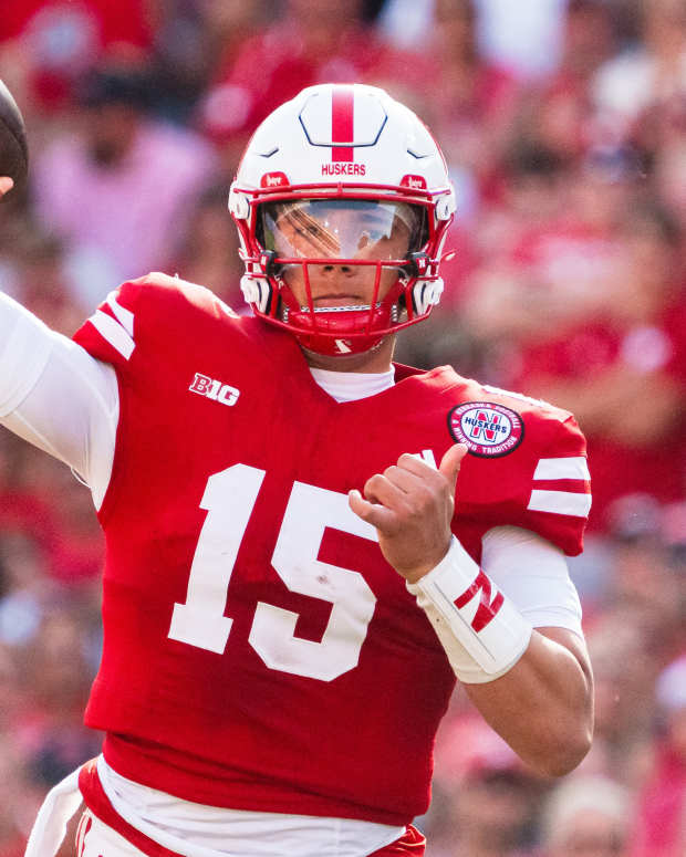 Oct 5, 2024; Lincoln, Nebraska, USA; Nebraska Cornhuskers quarterback Dylan Raiola (15) throws a pass against the Rutgers Scarlet Knights during the second quarter at Memorial Stadium. Mandatory Credit: Dylan Widger-Imagn Images