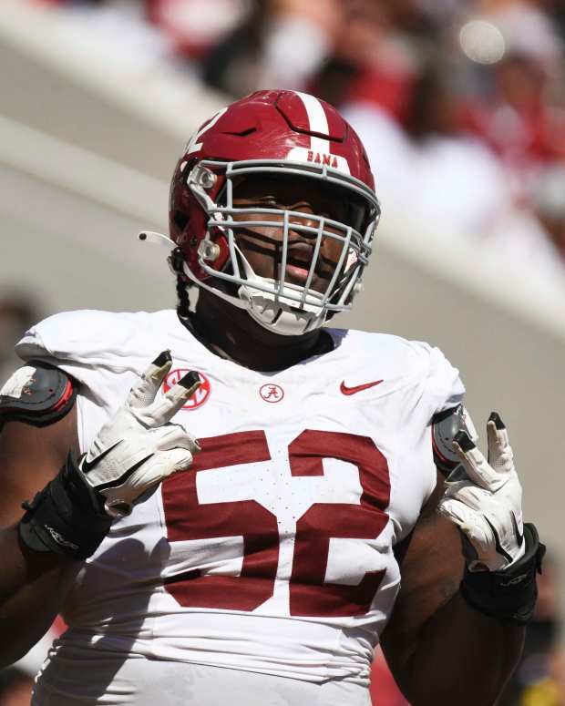 Apr 13, 2024; Tuscaloosa, AL, USA; Alabama offensive lineman Tyler Booker (52) celebrates after the offense scored a touchdown during the A-Day scrimmage at Bryant-Denny Stadium. Mandatory Credit: Gary Cosby Jr.-Imagn Images