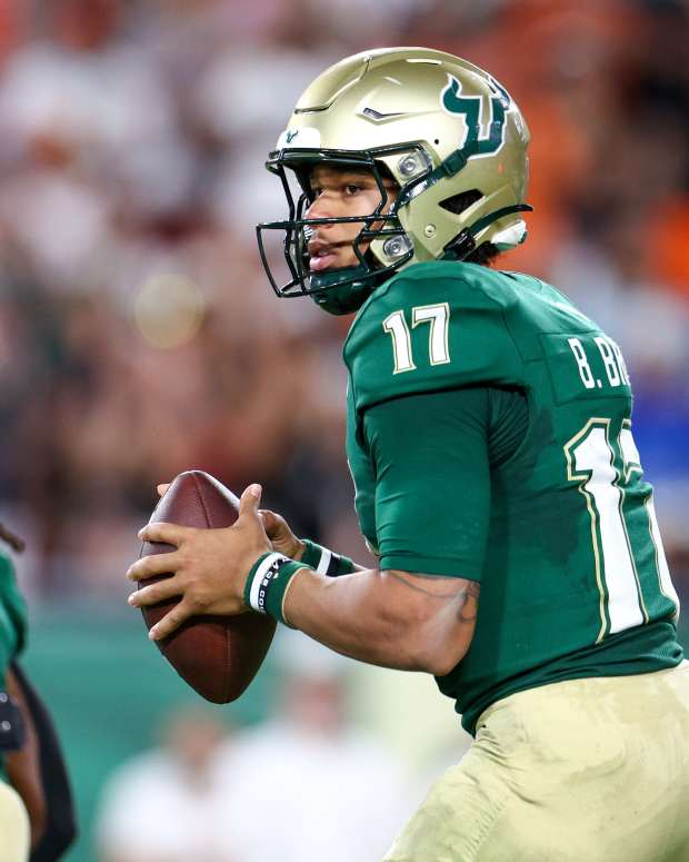 Sep 21, 2024; Tampa, Florida, USA; South Florida Bulls quarterback Byrum Brown (17) drops back to pass against the Miami Hurricanes in the first half at Raymond James Stadium. Mandatory Credit: Nathan Ray Seebeck-Imagn Images