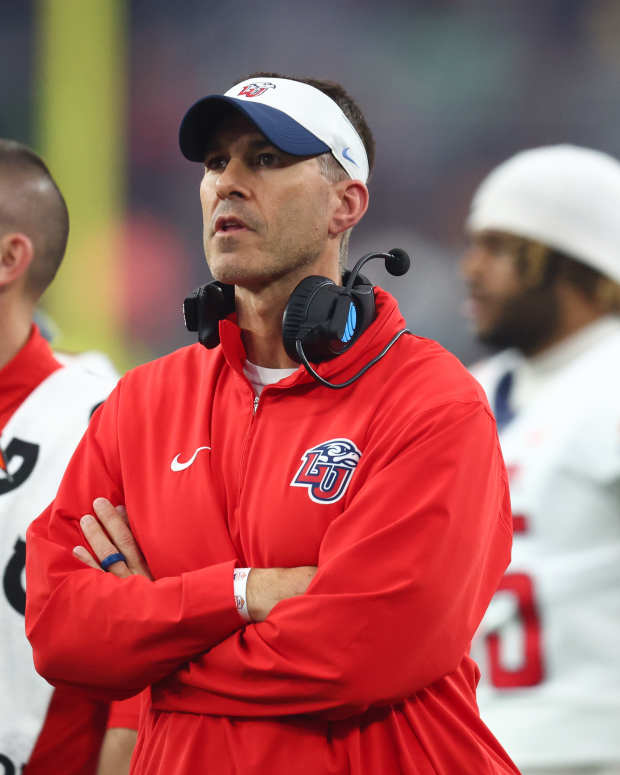 Jan 1, 2024; Glendale, AZ, USA; Liberty Flames head coach Jamey Chadwell looks on from the sidelines during the second quarter against the Oregon Ducks in the 2024 Fiesta Bowl at State Farm Stadium. Mandatory Credit: Mark J. Rebilas-Imagn Images