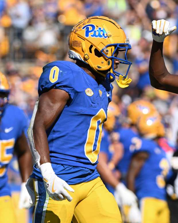 Sep 14, 2024; Pittsburgh, Pennsylvania, USA; Pittsburgh Panthers running back Desmond Reid celebrates with Raphael Williams Jr. (5) after a touchdown against the West Virginia Mountaineers during the second quarter at Acrisure Stadium. Mandatory Credit: Barry Reeger-Image Images