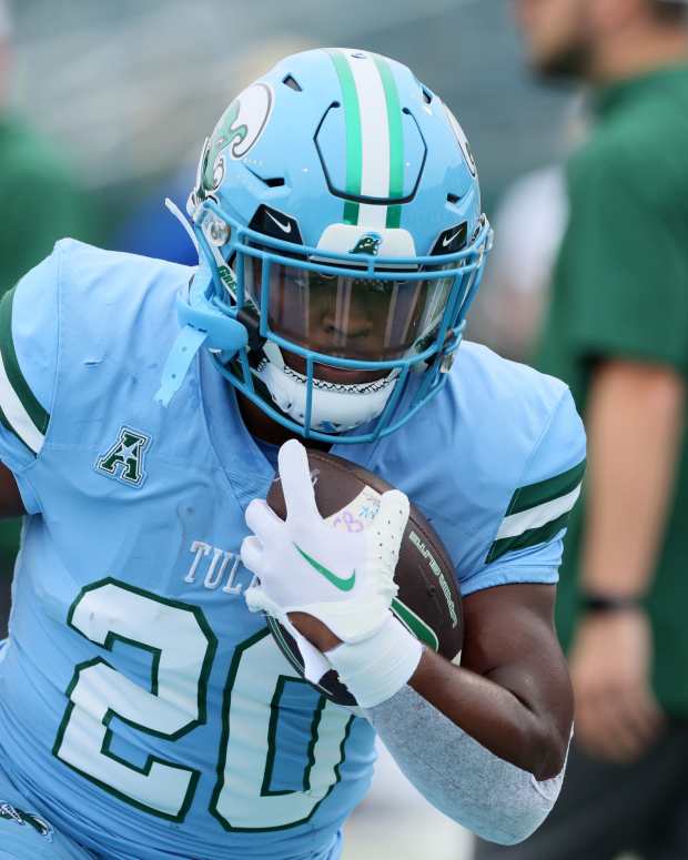 Nov 11, 2023; New Orleans, Louisiana, USA; Tulane Green Wave running back Arnold Barnes III (20) warms up before their game against the Tulsa Golden Hurricanes at Yulman Stadium. Mandatory Credit: Matthew Dobbins-Imagn Images