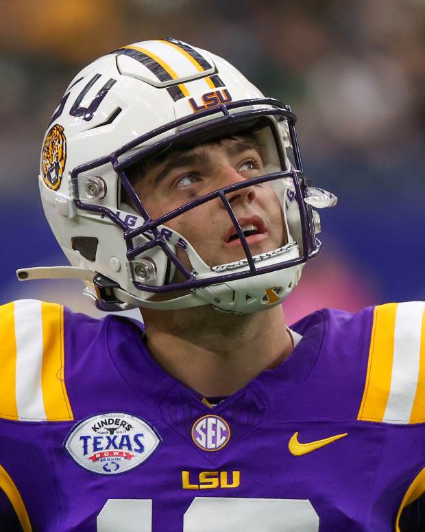 Dec 31, 2024; Houston, TX, USA; LSU Tigers quarterback Garrett Nussmeier (13) looks at the scoreboard during an official's time-out against the Baylor Bears in the second quarter at NRG Stadium. Mandatory Credit: Thomas Shea-Imagn Images