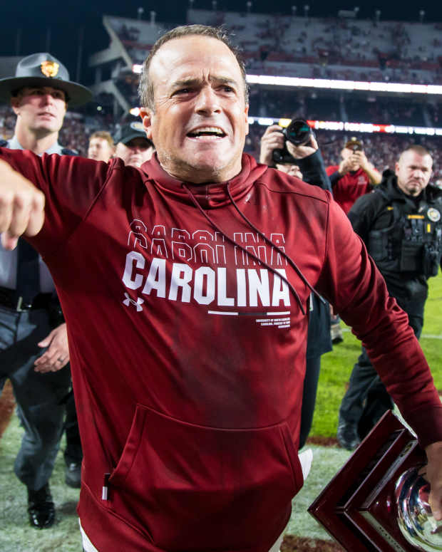 Nov 16, 2024; Columbia, South Carolina, USA; South Carolina Gamecocks head coach Shane Beamer celebrates beating the Missouri Tigers at Williams-Brice Stadium. He is holding the Mayors Cup, given to the winner of the South Carolina-Missouri game. Mandatory Credit: Jeff Blake-Imagn Images