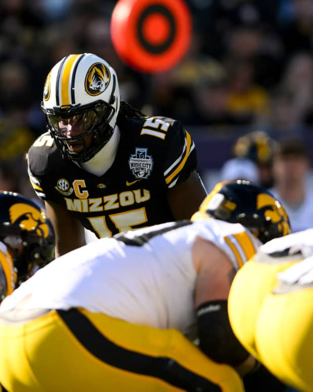 Dec 30, 2024; Nashville, TN, USA; Missouri Tigers defensive end Johnny Walker Jr. (15) sneaks a peak into the backfield against the Iowa Hawkeyes during the first half at Nissan Stadium. Mandatory Credit: Steve Roberts-Imagn Images