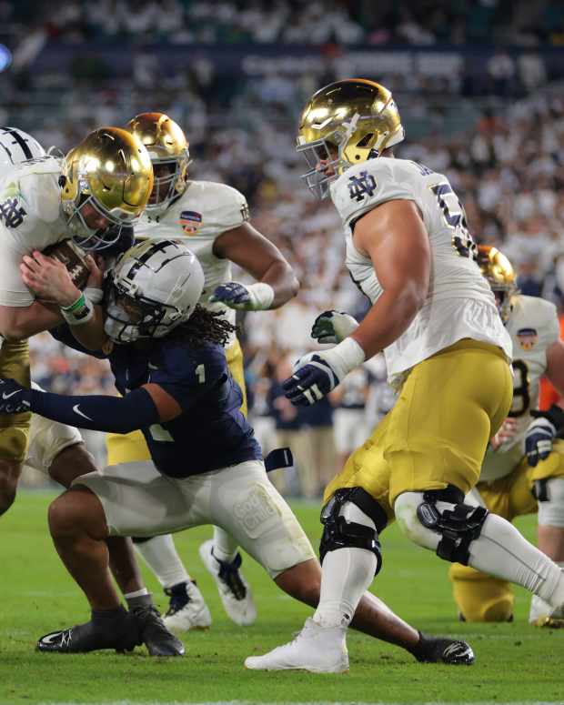 Jan 9, 2025; Miami, FL, USA; Notre Dame Fighting Irish quarterback Riley Leonard (13) runs the ball in the second half against the Penn State Nittany Lions in the Orange Bowl at Hard Rock Stadium. Mandatory Credit: Sam Navarro-Imagn Images