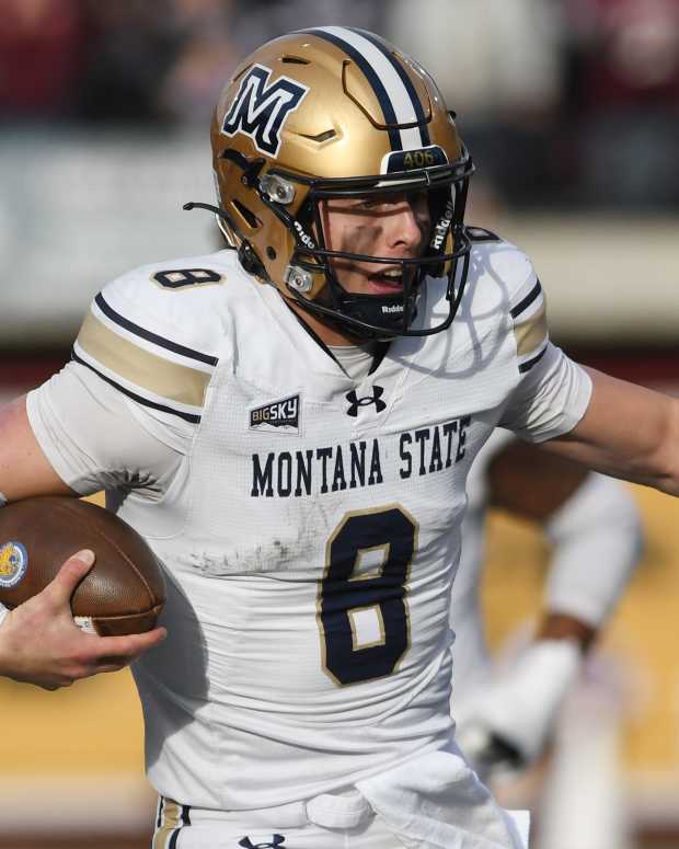 Nov 22, 2025; Missoula, MT, USA; Montana State Bobcats quarterback Justin Lamson (8) carries the ball and scores a touchdown against the Montana Grizzlies during the second half at Washington-Grizzly Stadium. Mandatory Credit: Michael Thomas Shroyer-Imagn Images