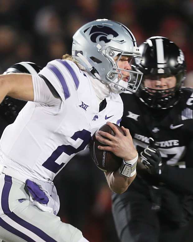 Kansas State Wildcats quarterback Avery Johnson (2) runs with the ball around Iowa State Cyclones linebacker Will McLaughlin (23) during the first quarter in the NCAA football at Jack Trice Stadium on Saturday, Nov. 30, 2024, in Ames, Iowa © Nirmalendu Majumdar/Ames Tribune / USA TODAY NETWORK via Imagn Images