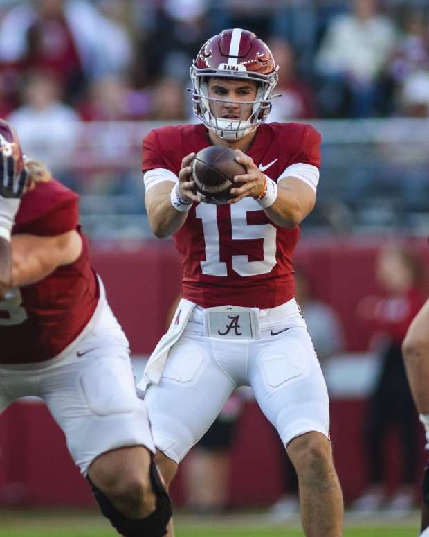 Nov 16, 2024; Tuscaloosa, Alabama, USA; Alabama Crimson Tide quarterback Ty Simpson (15) receives a snapped ball against the Mercer Bears during the third quarter at Bryant-Denny Stadium. Mandatory Credit: Will McLelland-Imagn Images