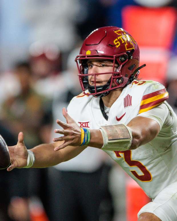 Nov 9, 2024; Kansas City, Missouri, USA; Iowa State Cyclones quarterback Rocco Becht (3) pitches the ball during the fourth quarter against the Kansas Jayhawks at GEHA Field at Arrowhead Stadium. Mandatory Credit: William Purnell-Imagn Images
