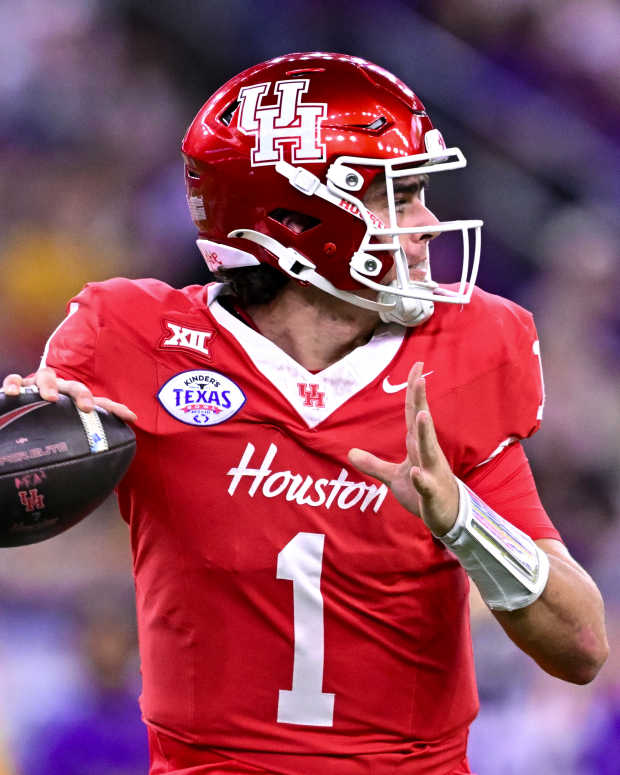 Dec 27, 2025; Houston, TX, USA; Houston Cougars quarterback Conner Weigman (1) looks to pass the ball during the first half against the Louisiana State Tigers at NRG Stadium. Mandatory Credit: Maria Lysaker-Imagn Images