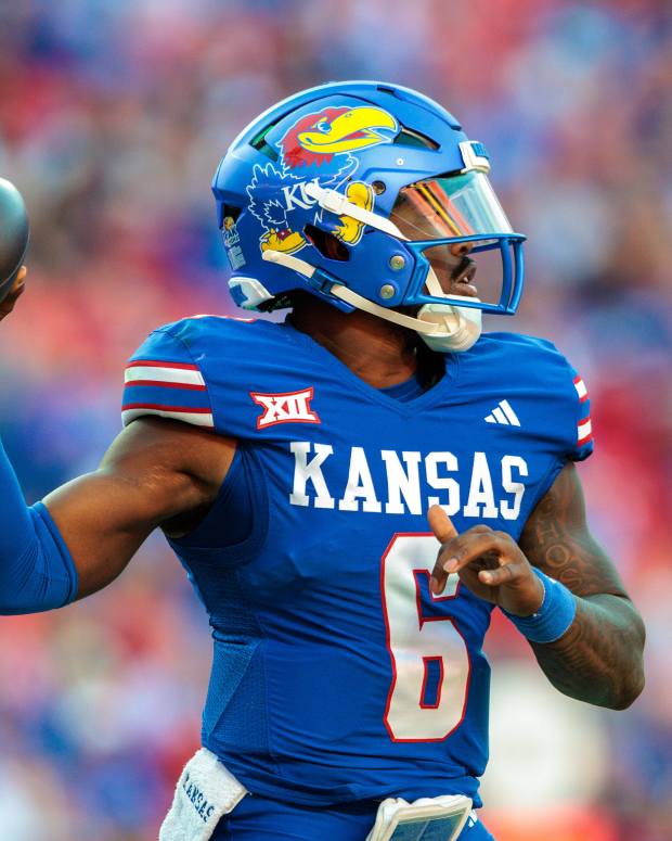 Oct 19, 2024; Kansas City, Missouri, USA; Kansas Jayhawks quarterback Jalon Daniels (6) passes the ball against the Houston Cougars during the third quarter at GEHA Field at Arrowhead Stadium. Mandatory Credit: William Purnell-Imagn Images