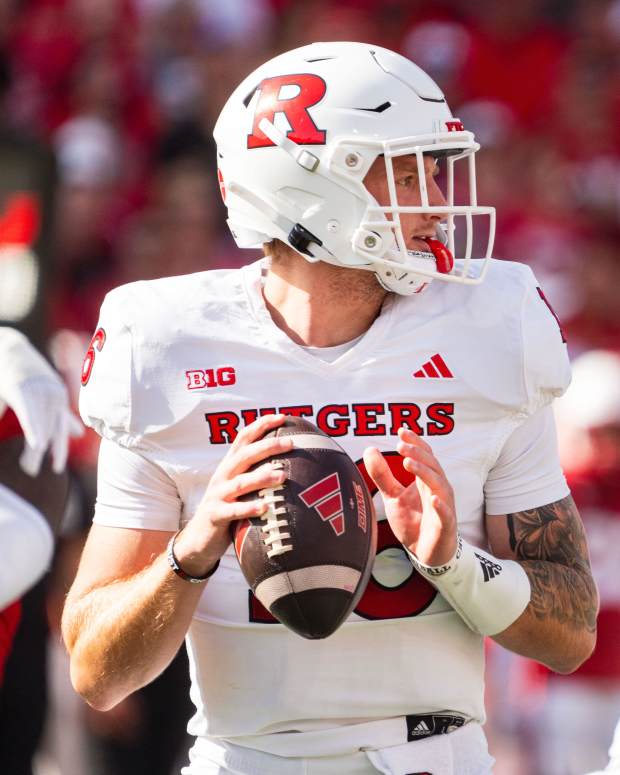 Oct 5, 2024; Lincoln, Nebraska, USA; Rutgers Scarlet Knights quarterback Athan Kaliakmanis (16) drops back to pass against the Nebraska Cornhuskers during the first quarter at Memorial Stadium. Mandatory Credit: Dylan Widger-Imagn Images
