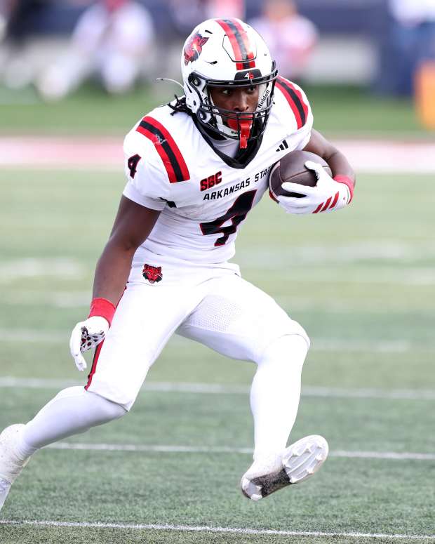 Sep 6, 2025; Little Rock, Arkansas, USA; Arkansas State Red Wolves running back Devin Spencer (40) rushes during the second quarter against the Arkansas Razorbacks at War Memorial Stadium. Mandatory Credit: Nelson Chenault-Imagn Images