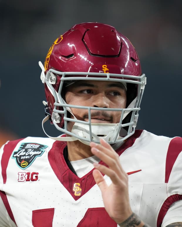 Dec 27, 2024; Las Vegas, NV, USA; Southern California Trojans quarterback Jayden Maiava (14) throws the ball against the Texas A&M Aggies in the first half at Allegiant Stadium. Mandatory Credit: Kirby Lee-Imagn Images