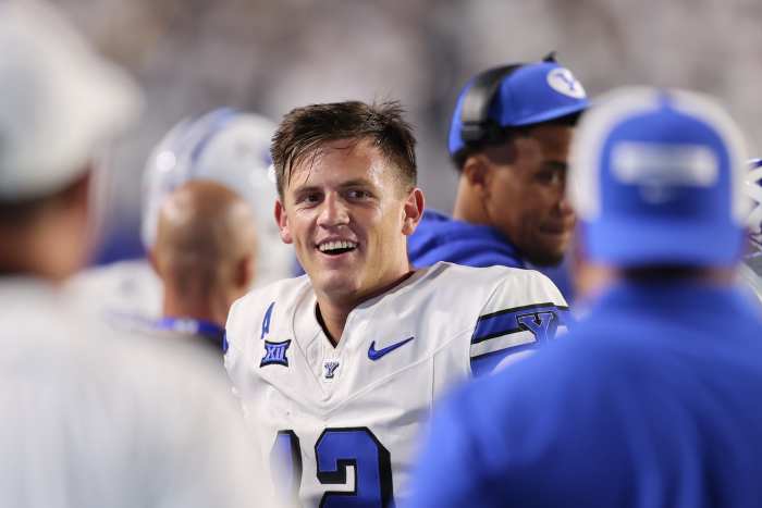 Sep 21, 2024; Provo, Utah, USA; Brigham Young Cougars quarterback Jake Retzlaff (12) reacts to a play from the sideline against the Kansas State Wildcats during the third quarter at LaVell Edwards Stadium. Mandatory Credit: Rob Gray-Imagn Images
