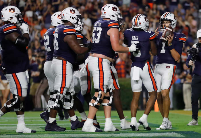 Sep 16, 2023; Auburn, Alabama, USA; Auburn Tigers quarterback Payton Thorne (1) celebrates with teammates after scoring a touchdown against the Samford Bulldogs during the second quarter at Jordan-Hare Stadium. Mandatory Credit: John Reed-USA TODAY Sports