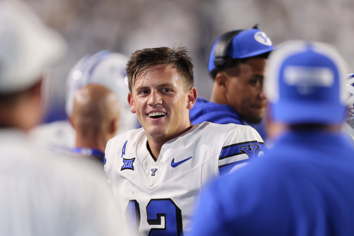 Sep 21, 2024; Provo, Utah, USA; Brigham Young Cougars quarterback Jake Retzlaff (12) reacts to a play from the sideline against the Kansas State Wildcats during the third quarter at LaVell Edwards Stadium. Mandatory Credit: Rob Gray-Imagn Images